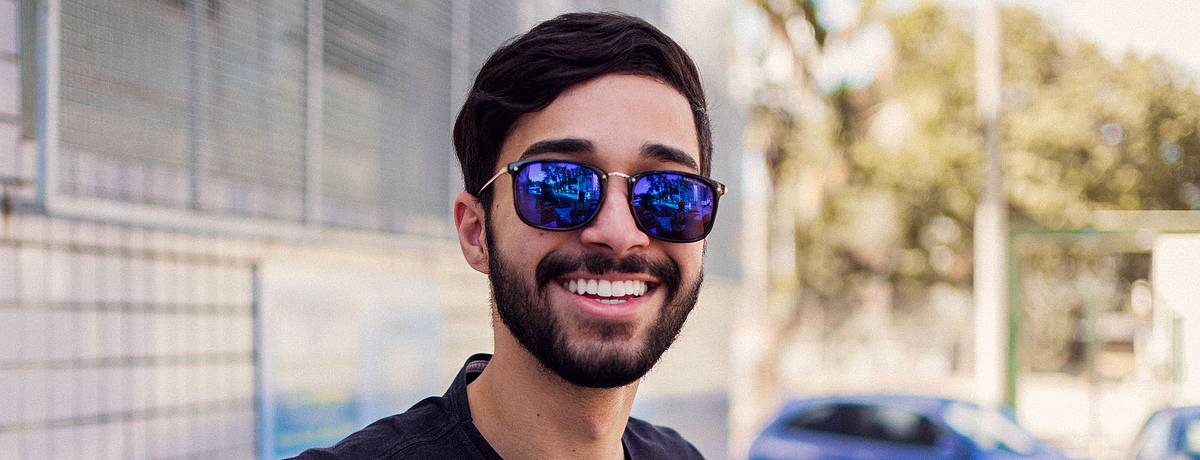 Young man smiling in sunglasses